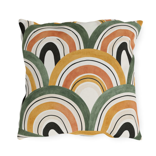 Overlapping ochre, terracotta and olive arches on a cream outdoor pillow