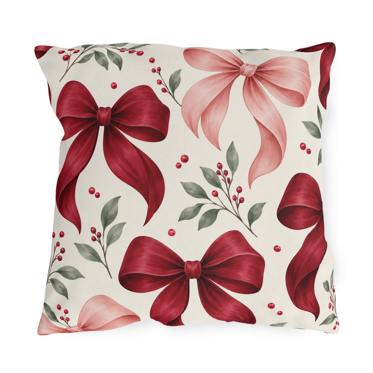 Winter outdoor pillow with watercolor red and pink satin bows, red berries and green leaves on cream