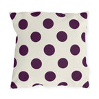 Aubergine polka dot outdoor pillow with large deep purple dots on cream