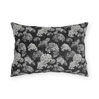 White and grey hydrangeas on black outdoor lumbar pillow