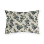 Blue juniper berries and green foliage on cream outdoor lumbar pillow