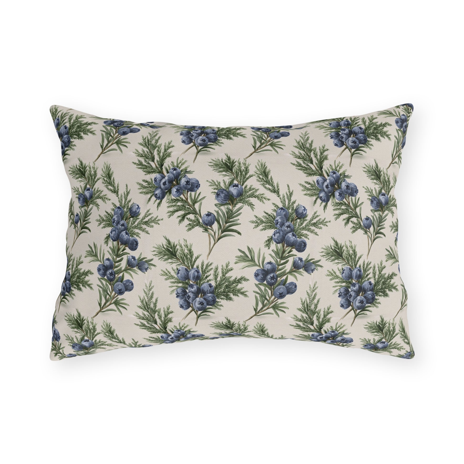Blue juniper berries and green foliage on cream outdoor lumbar pillow