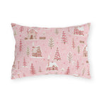 Snow-covered pink cottages and fir trees on pink outdoor lumbar pillow