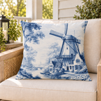 Delft blue windmill outdoor pillow styled on a porch