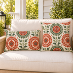 Terracotta and sage folk medallion outdoor pillow and outdoor lumbar pillow styled together as a set