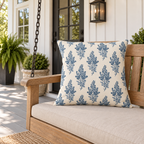 Blue botanical outdoor pillow on an American porch