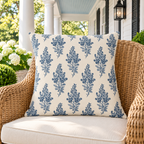 Blue botanical outdoor pillow on a classic porch
