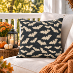 Bone white bat block print outdoor pillow on charcoal styled on a porch