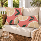 Coral citrus slice outdoor pillow and outdoor lumbar pillow styled together as a set