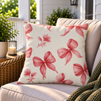 Pink ribbon bow outdoor pillow styled on patio furniture