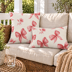 Pink ribbon bow outdoor pillow and outdoor lumbar pillow styled together as a set