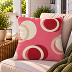 Pink and red modern circle outdoor pillow styled on patio furniture