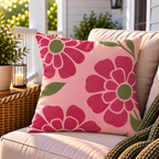 Pink retro flower outdoor pillow styled on patio furniture