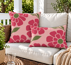 Pink retro flower outdoor pillow and outdoor lumbar pillow styled together as a set