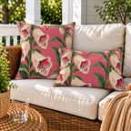 Pink foxglove floral outdoor lumbar pillow styled with matching pillows as a set