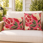 Pink and red pomegranate outdoor pillow and outdoor lumbar pillow styled together as a set