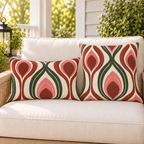 Rust and green retro ogee outdoor pillow and outdoor lumbar pillow styled together as a set