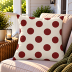 Merlot polka dot outdoor pillow styled on patio furniture