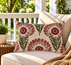 Wine red block print flower outdoor lumbar pillow styled on patio furniture