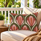 Olive and rust retro tulip outdoor lumbar pillow styled on patio furniture