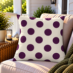 Aubergine polka dot outdoor pillow styled on patio furniture