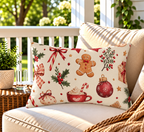 Red gingerbread and candy cane Christmas outdoor lumbar pillow styled on patio furniture
