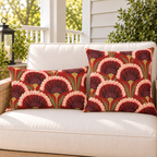 Red art deco fan flower outdoor pillow and outdoor lumbar pillow styled together as a set