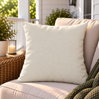 Solid cream neutral outdoor pillow styled on patio furniture