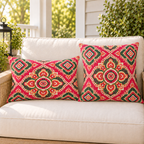 Pink Moroccan medallion outdoor pillow and outdoor lumbar pillow styled together as a set