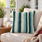 Cream outdoor pillow with teal painted stripes, second view