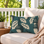 Deep teal outdoor lumbar pillow with cream block print acorns and oak leaves, second view