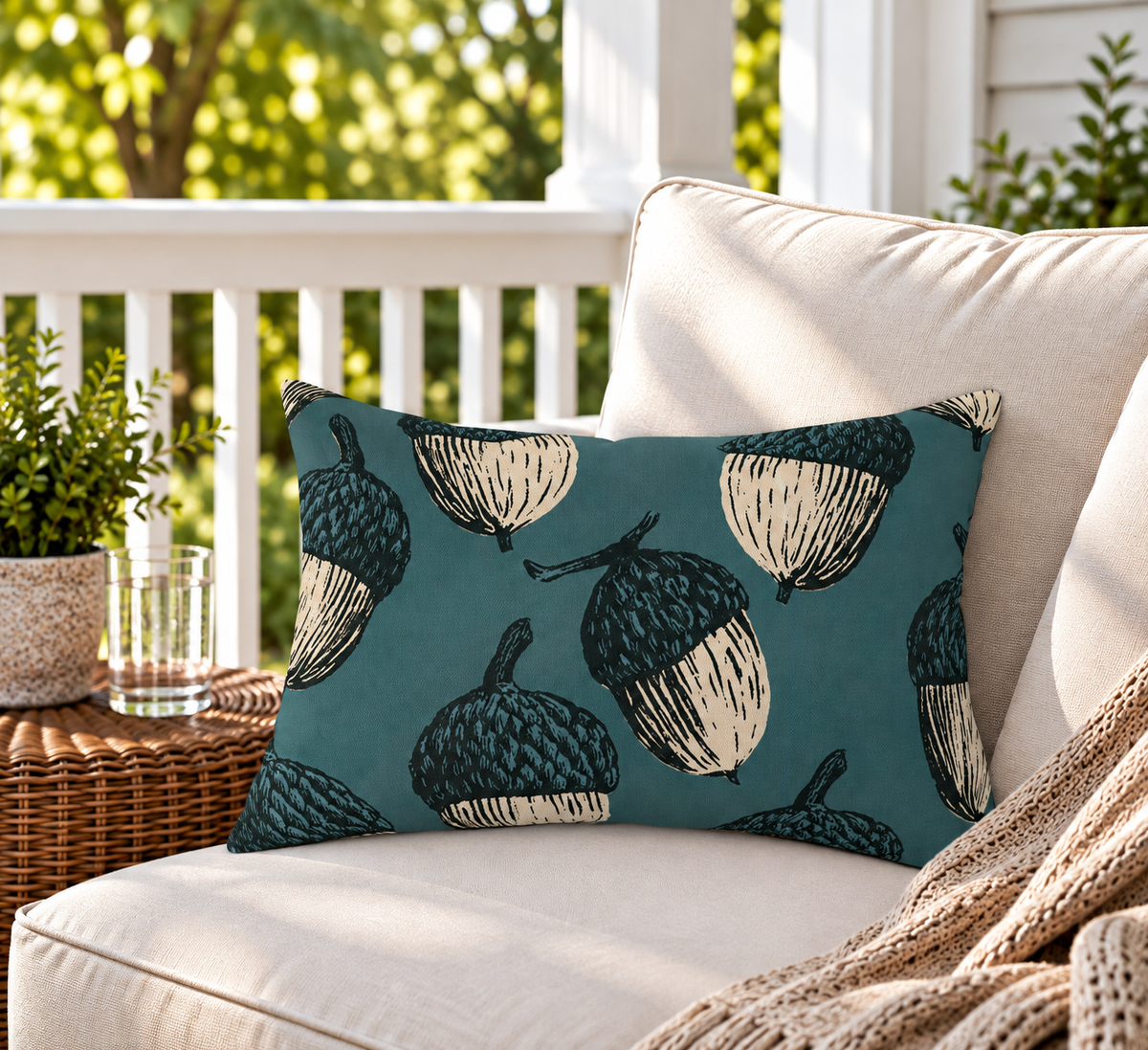 Deep teal outdoor lumbar pillow with oversized block print acorns, second view