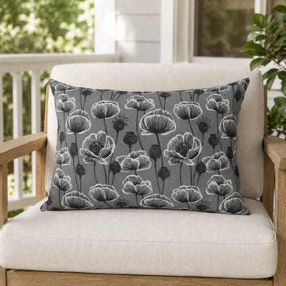 White and charcoal poppies and seed heads on grey outdoor lumbar pillow