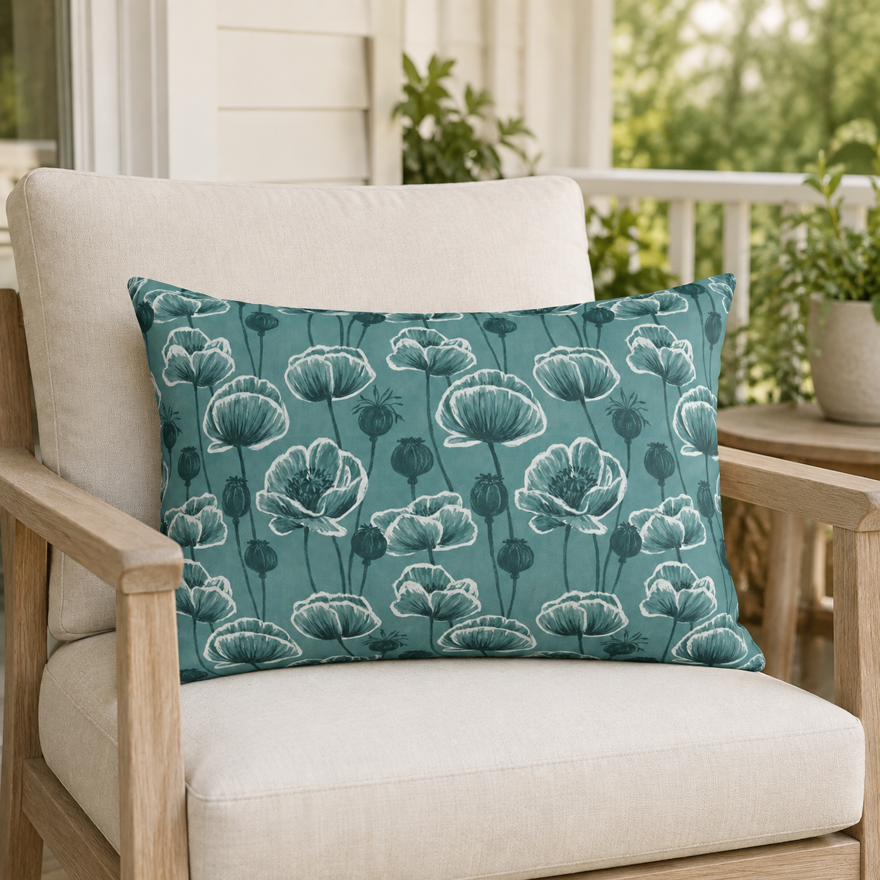 Teal and white poppies and seed heads on teal outdoor lumbar pillow