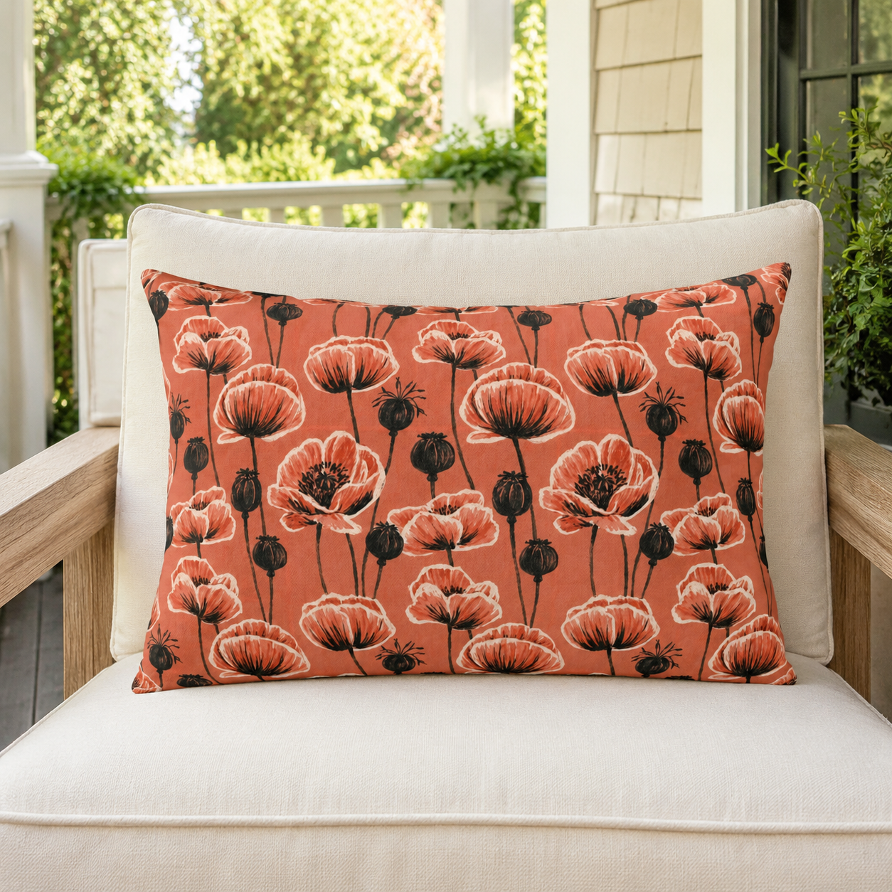 Coral poppies and black seed heads on terracotta outdoor lumbar pillow