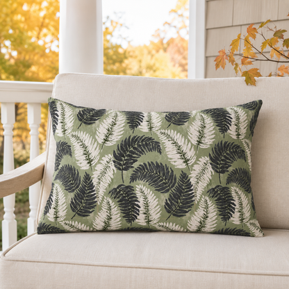 Navy and cream fern fronds on sage green outdoor lumbar pillow