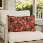 Cream and black sea coral branches on coral red outdoor lumbar pillow