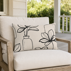 Cream outdoor lumbar pillow with black line-drawn plants and vases, second view