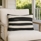 Cream outdoor lumbar pillow with wide black painted stripes, second view