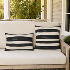 Wide black brushstroke stripes with hand-painted edges on cream, pattern detail