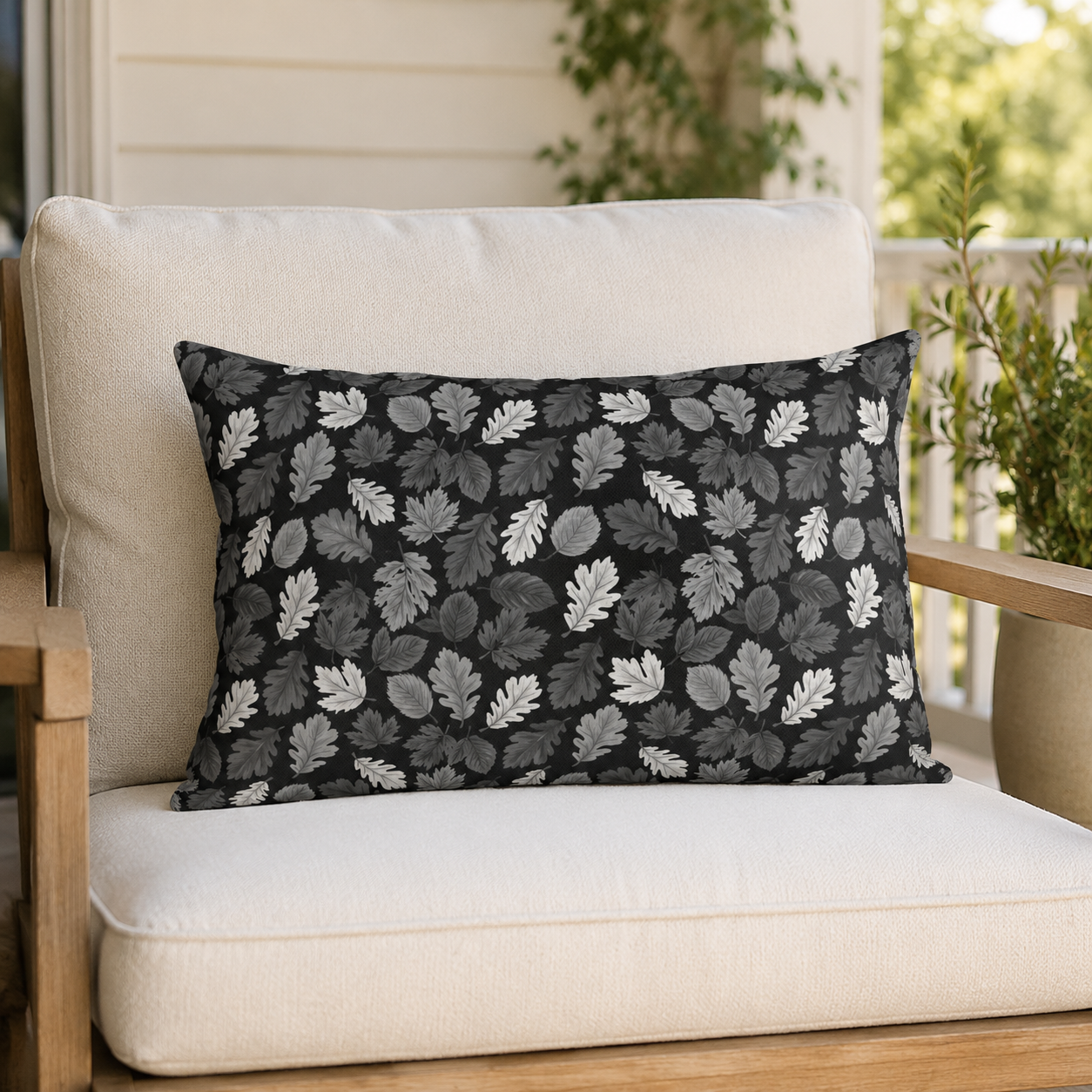 Charcoal, grey and white autumn leaves on black outdoor lumbar pillow