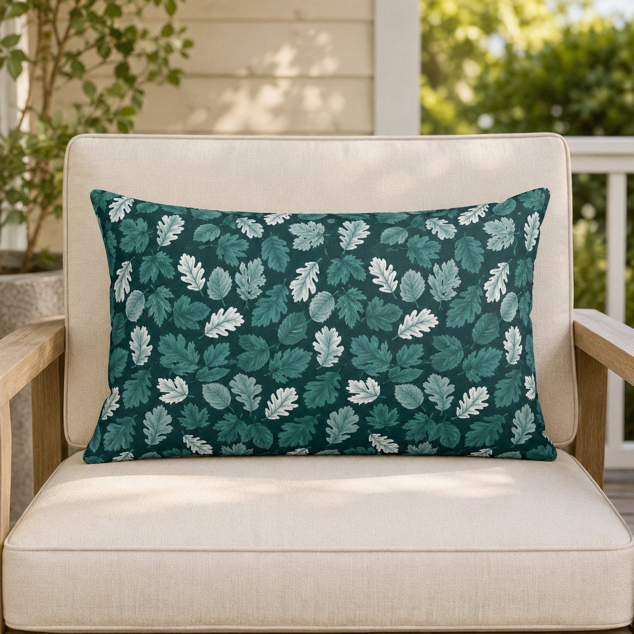 Teal, pine and white autumn leaves on dark teal outdoor lumbar pillow