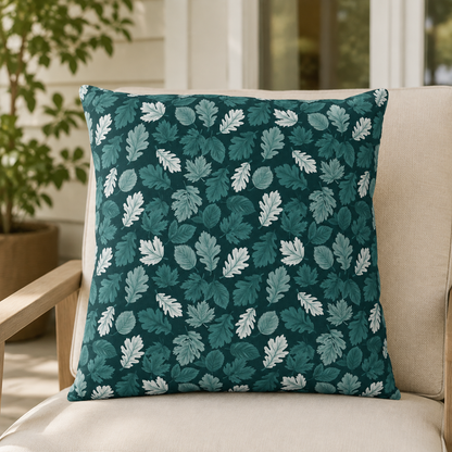 Teal, pine and white autumn leaves on dark teal outdoor pillow