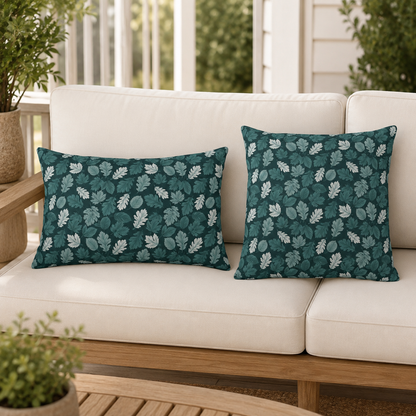 Teal, pine and white autumn leaves on dark teal outdoor pillow
