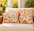 Orange pumpkin and bow fall outdoor pillow and outdoor lumbar pillow styled together as a set