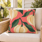 Coral Chinese lantern pod fall outdoor pillow styled on patio furniture