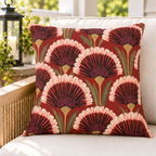Red art deco fan flower outdoor pillow styled on patio furniture