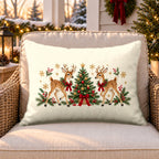 Cream Christmas reindeer outdoor lumbar pillow on a rattan chair on a snowy Christmas porch