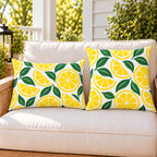 Yellow lemon citrus outdoor pillow and outdoor lumbar pillow styled together as a set on a porch loveseat