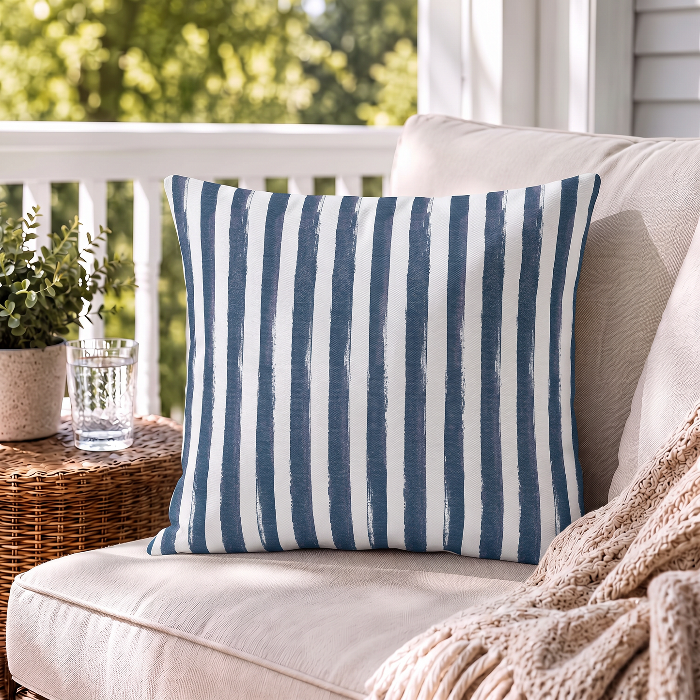 Hand-painted navy and white vertical stripe outdoor pillow